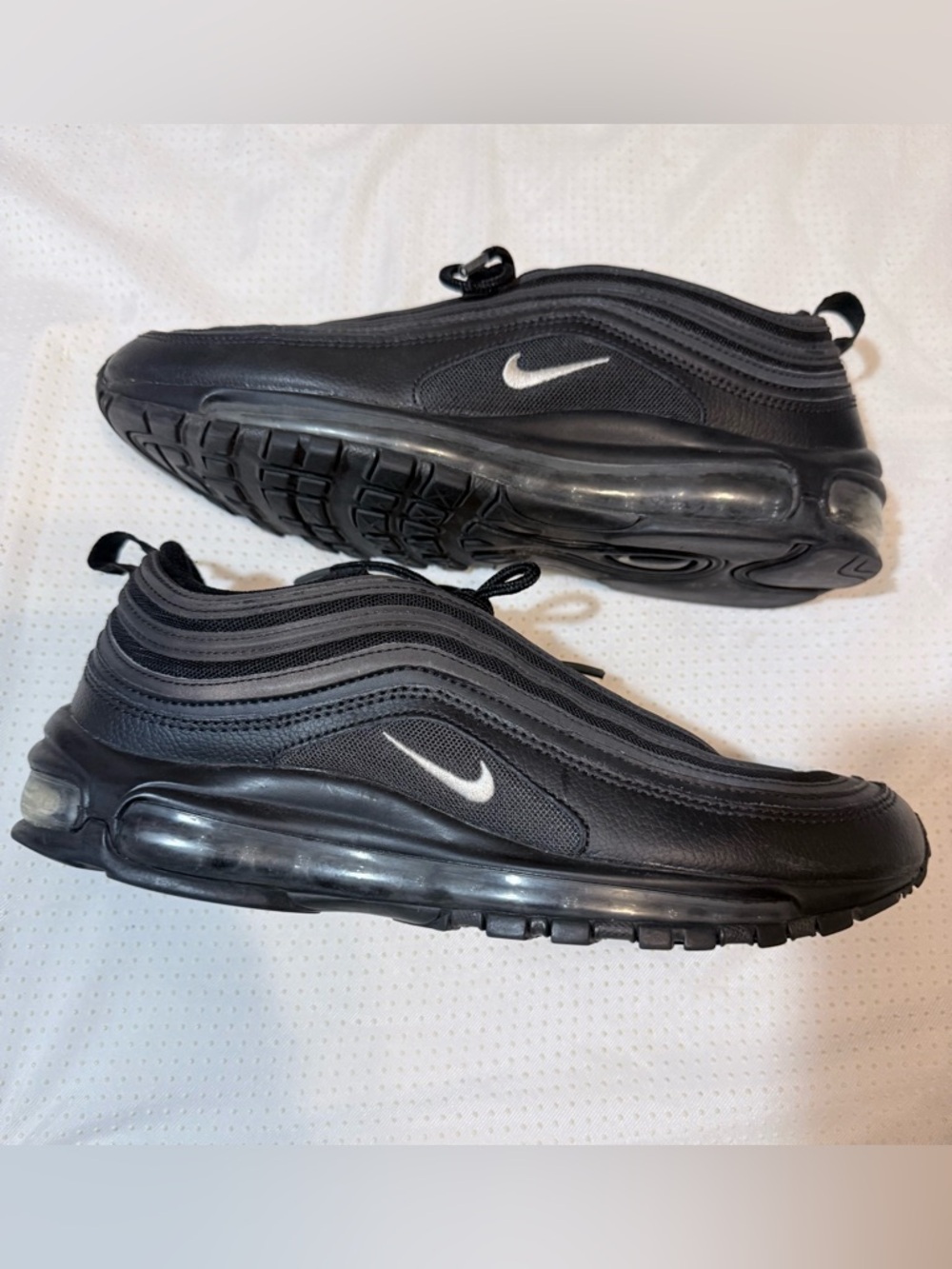 Nike Men’s Black Sneakers with White Swoosh Accent